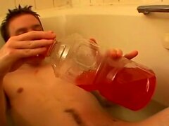 Piss loving young man playing with his cock in a bubble bath