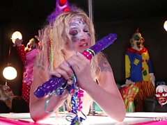 Clown Leya Falcon plays with a big purple dildo
