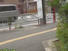 Asian lass on the streets finds a place to piss
