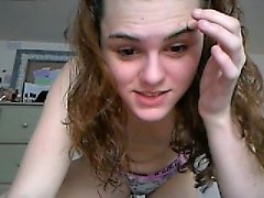 Teen redhead does a striptease